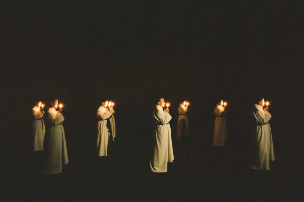 Placeholder — intended image: Monks at Vigils in candlelit darkness, 3:00 a.m., long exposure atmosphere